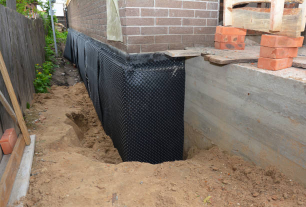 Happy homeowners after waterproofing job in Chardon